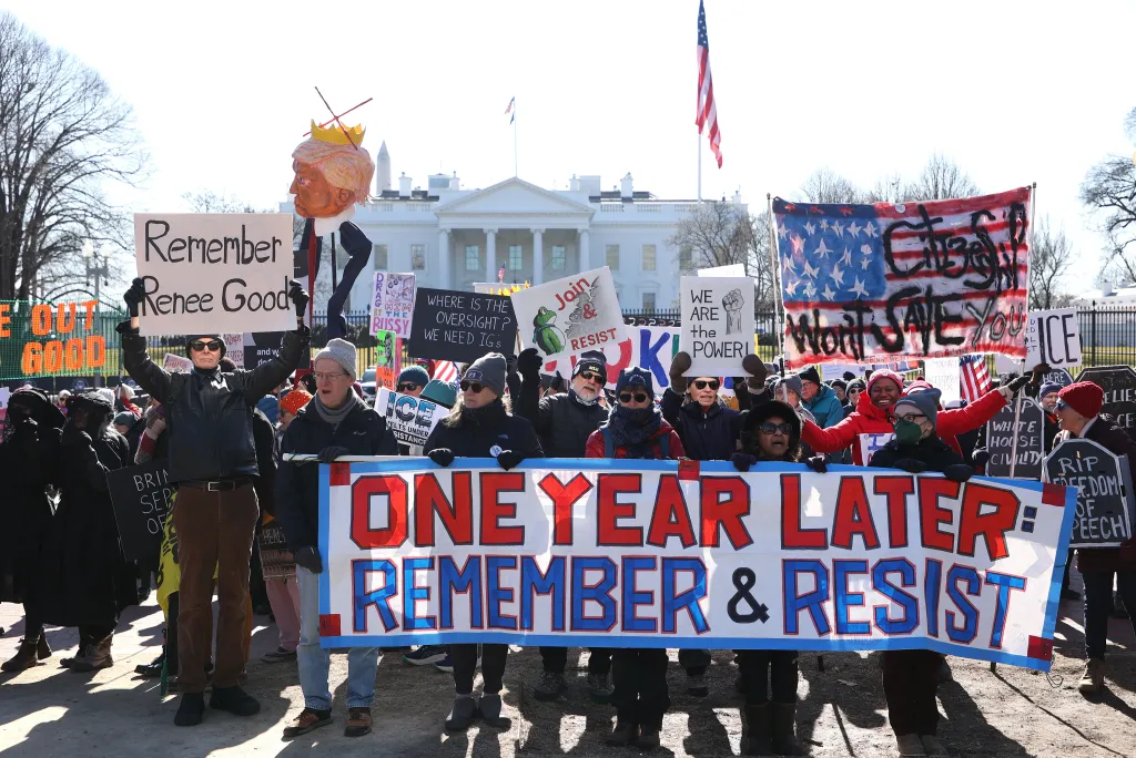 Demonstrators hold signs as they protest against ICE in front of the White House in Washington DC, USA, on January 20, 2026.