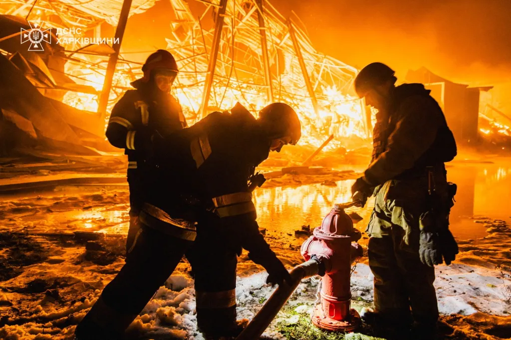 Firefighters battling a large fire at a private enterprise in Kharkiv, Ukraine, after a Russian missile attack.