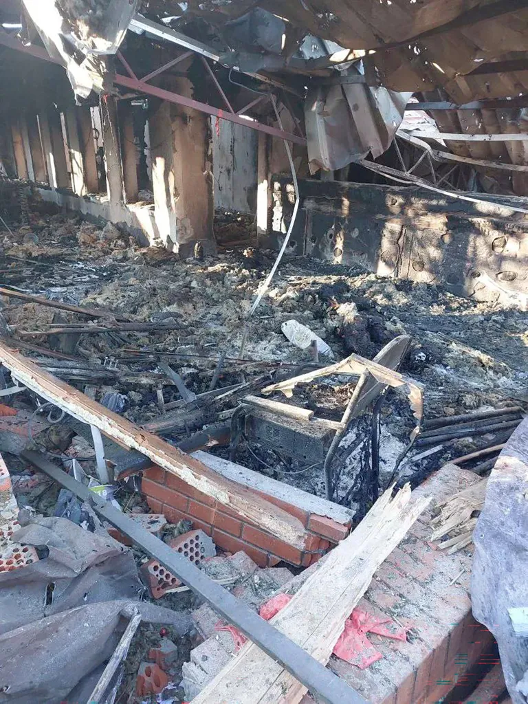 Debris and charred remains on the floor of a hotel after a drone attack in Khorly, Ukraine.