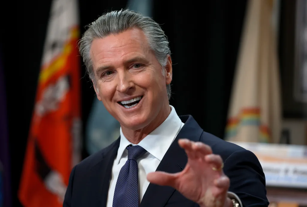 Governor Gavin Newsom speaking at a press conference.