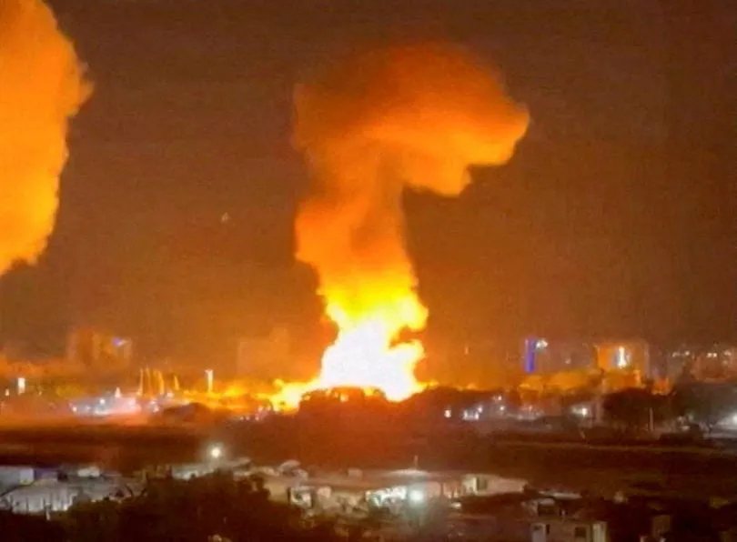A large plume of smoke rises in the air after an explosion in Caracas, Venezuela, on Jan. 3, 2026.