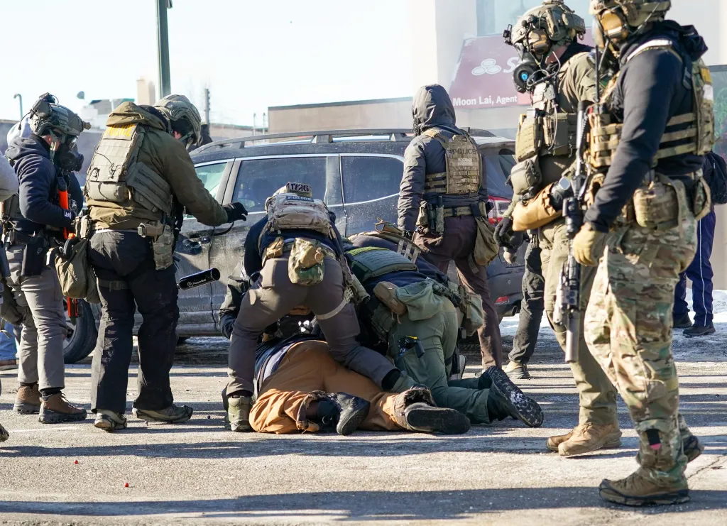 ICE officers subdue Pretti