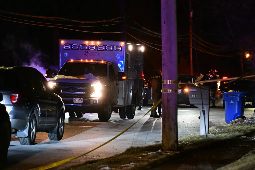 Police vehicles and an ambulance at a crime scene in Piscataway, New Jersey.