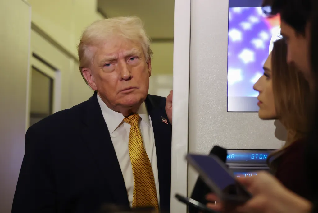 President Donald Trump speaks to the media aboard Air Force One en route to Washington, DC on Jan. 4, 2026.