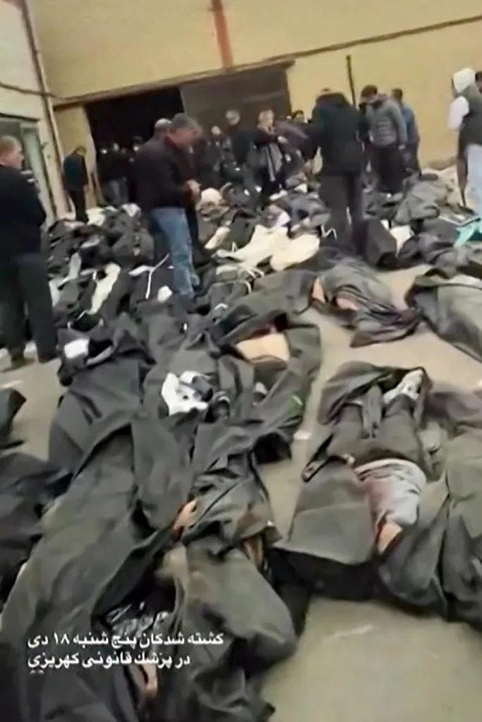 Dozens of bodies in body bags laid out for family members in the courtyard of the Forensic Diagnostic and Laboratory Center of Tehran Province in Kahrizak.