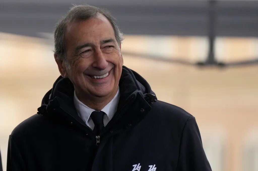 Milan's mayor Giuseppe Sala smiling in a dark jacket.