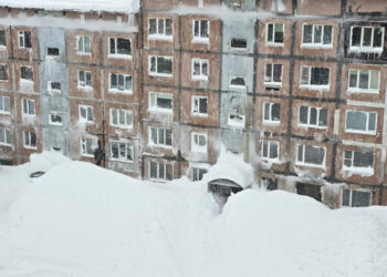 Towering Snowdrifts Bury City on Remote Russian Peninsula