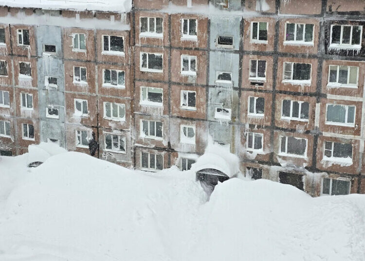 Towering Snowdrifts Bury City on Remote Russian Peninsula