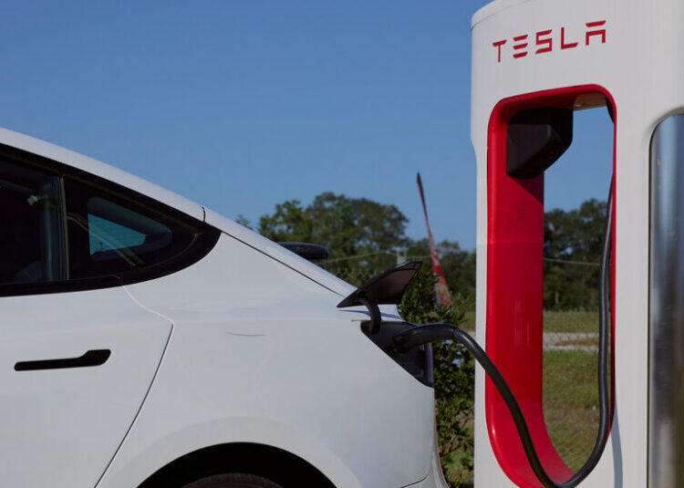 Tesla Profit Slumps, but Investors May Not Care