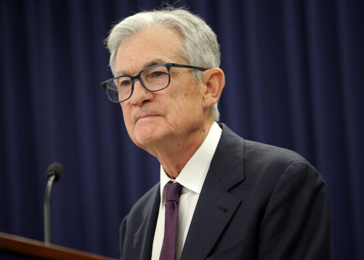 Fed Holds Rates Steady as It Points to an Improving Economy