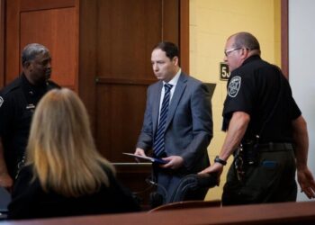 Husband Denies Plot in Double Murder Trial, Calling Accusations ‘Crazy’