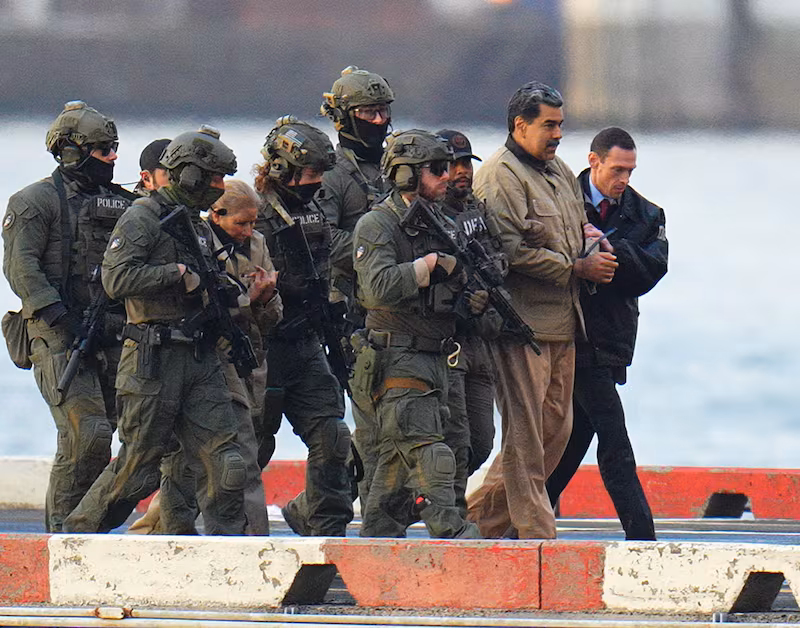 Maduro and his wife, Cilia Flores, were escorted by armed Federal agents en route to a Federal courthouse in Manhattan on Monday.