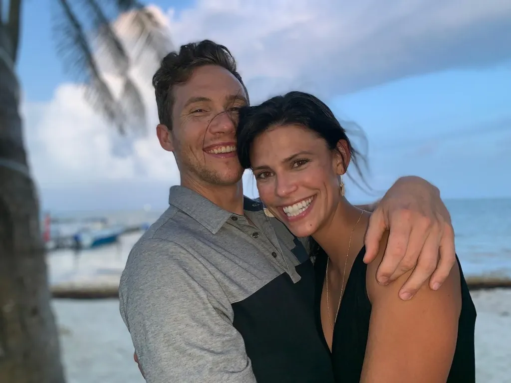 Spencer Tepe and Monique Tepe smiling and embracing.