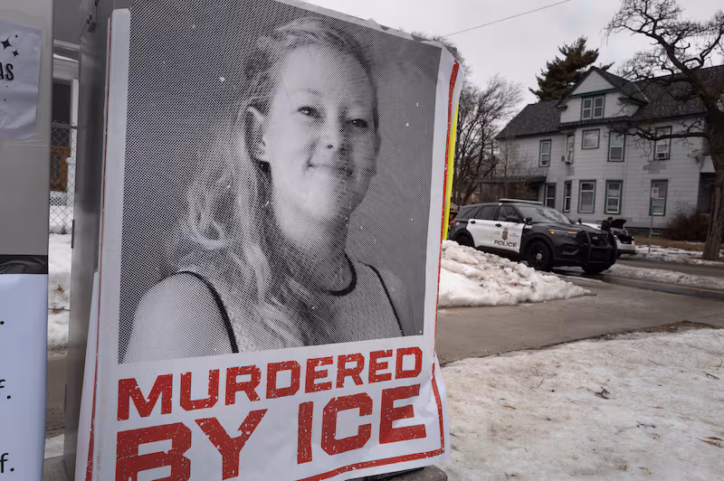 MINNEAPOLIS, MINNESOTA - JANUARY 16: A poster featuring Renee Good sits along the street near a memorial to Good on January 16, 2026 in Minneapolis, Minnesota. Protests have sparked up around the city after a federal agent fatally shot Good in her car during an incident in south Minneapolis on January 7. (Photo by Scott Olson/Getty Images)