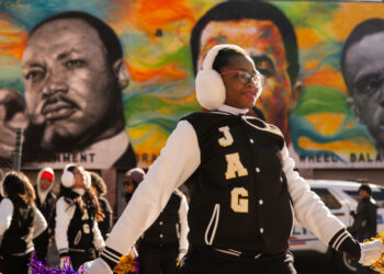 Hundreds march to celebrate MLK — and protest Trump