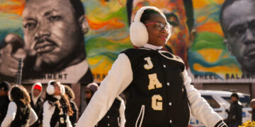 Hundreds march to celebrate MLK — and protest Trump