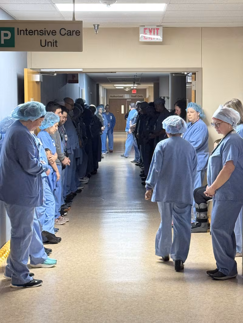 Alex Pretti's colleagues hold a moment a moment of silence at Minneapolis VA Health Care System hospital, in Minneapolis, Minnesota.