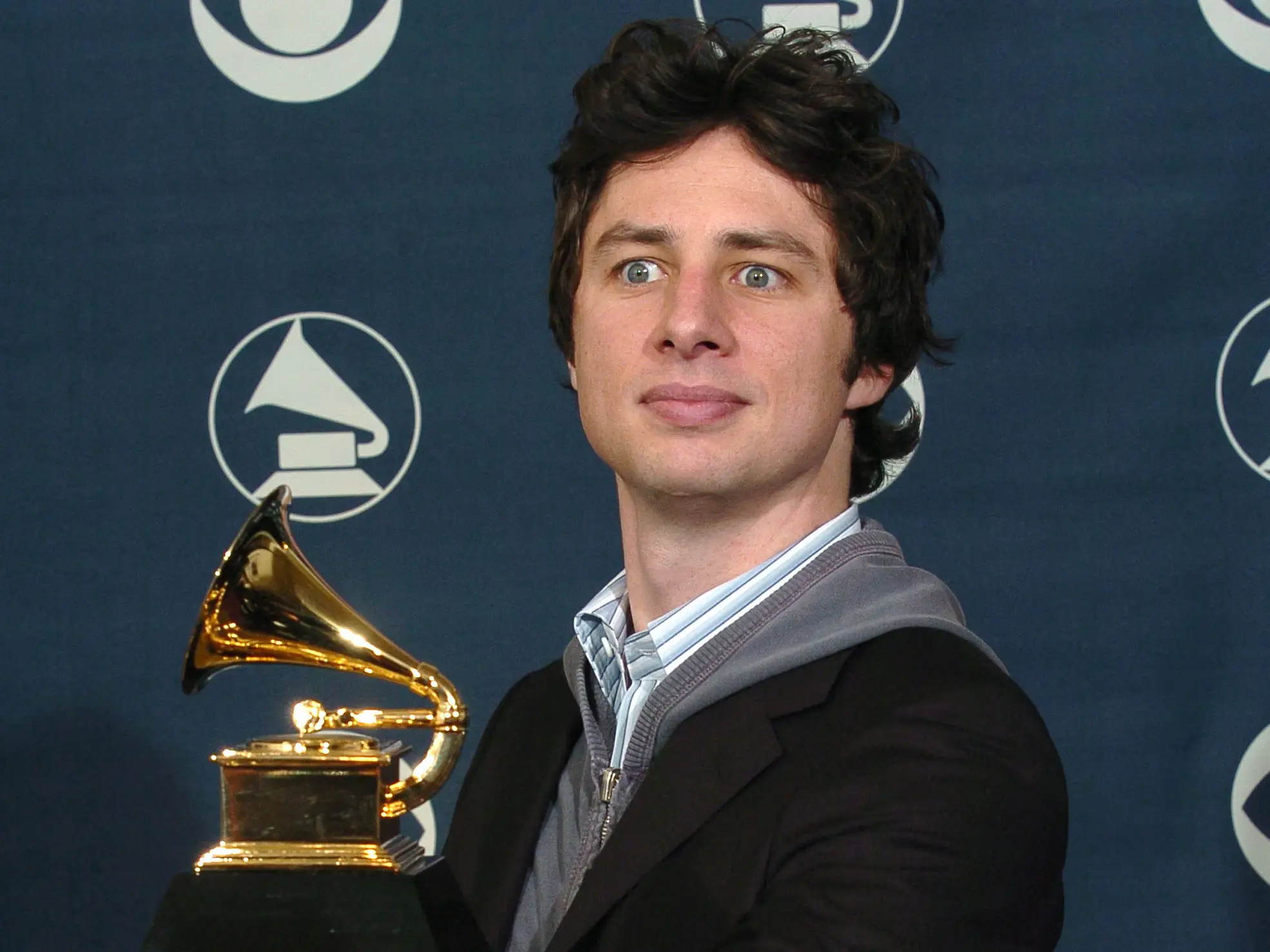 Zach Braff holds a Grammy award
