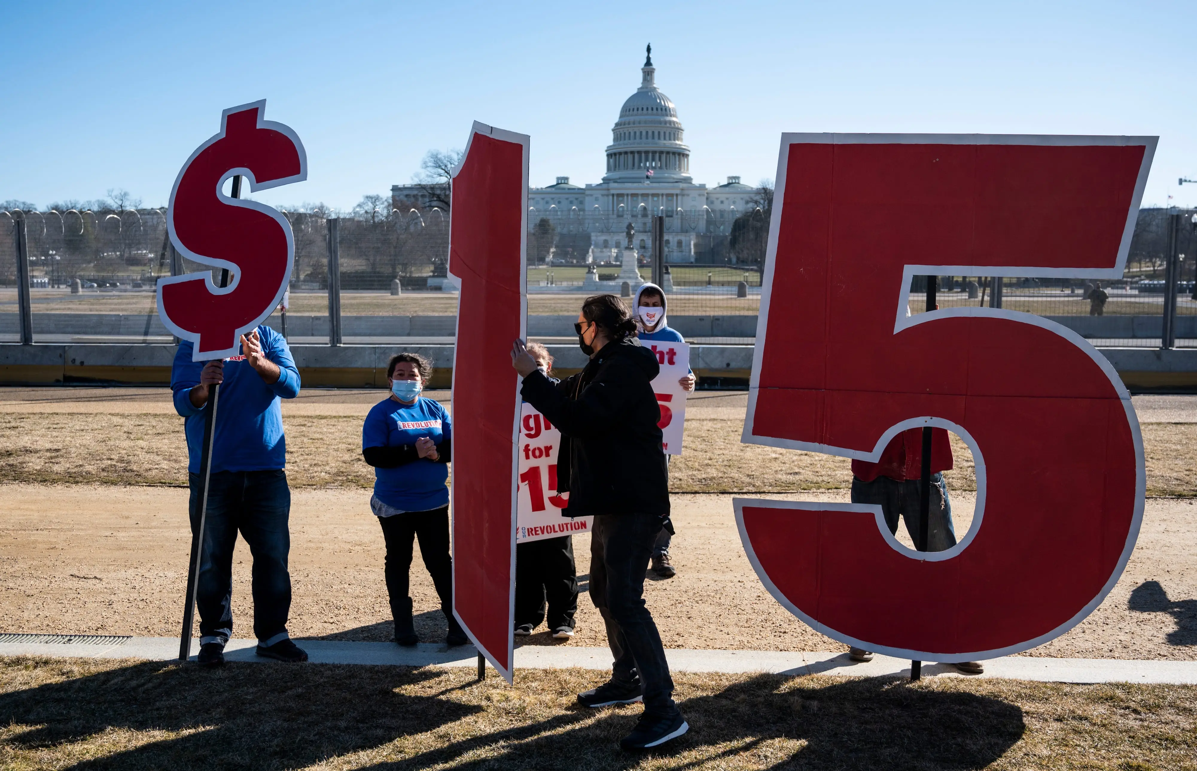 $15 minimum wage sign outside capitol
