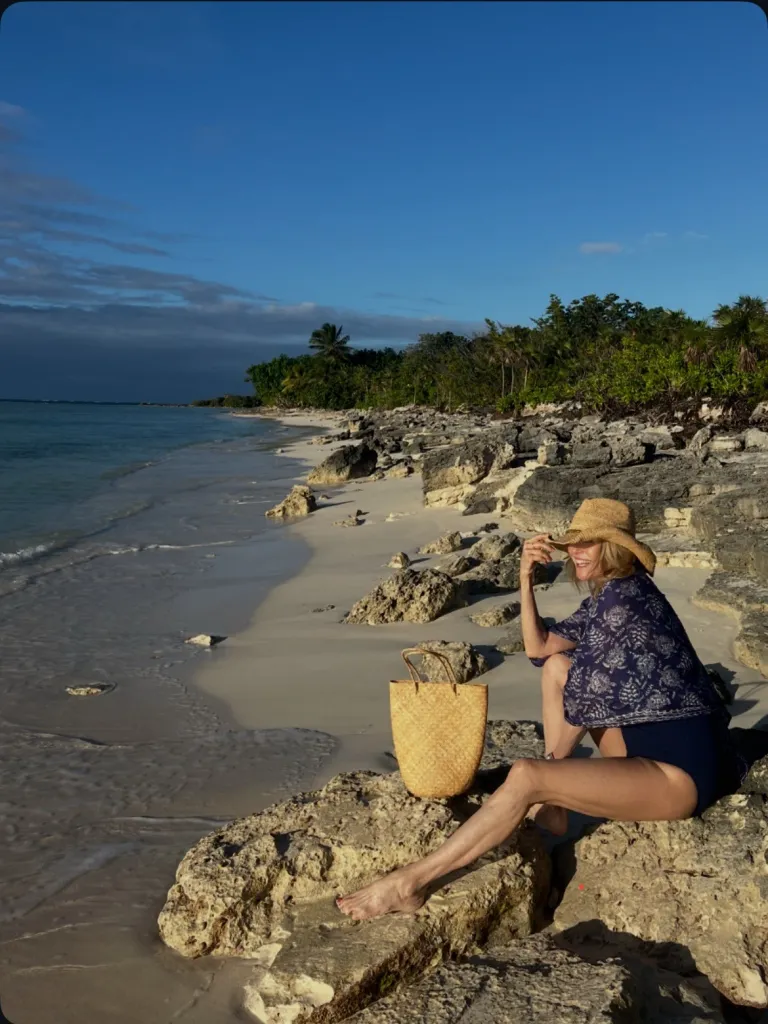 In one photo, Brinkley posed on a rocky shoreline as gentle waves rolled in behind her. 