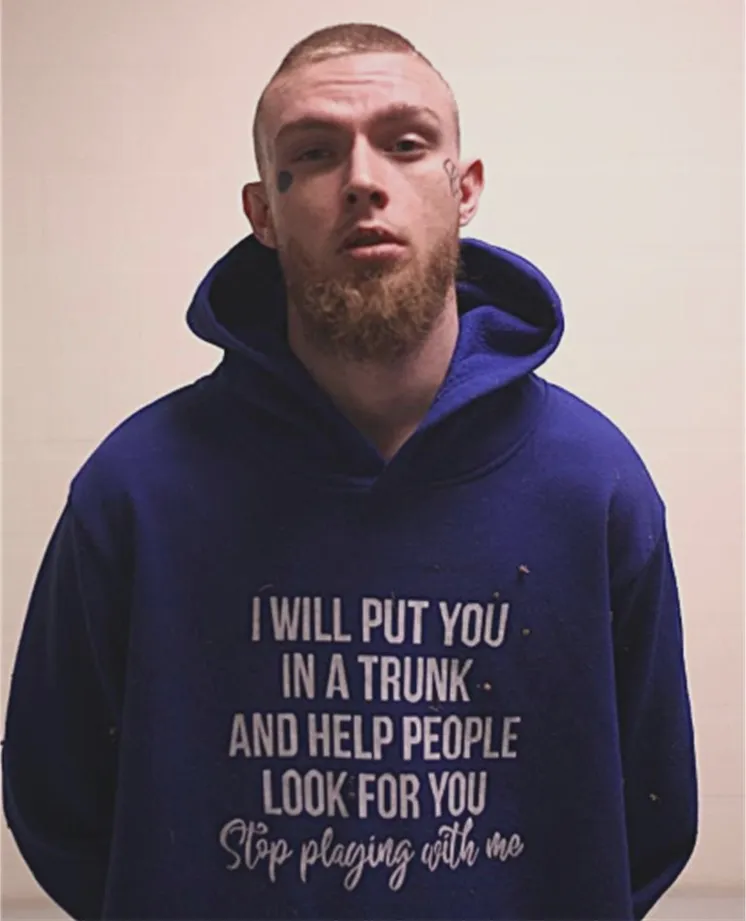 Kruz Dean Wanser was arrested in connection to a death in Texas wearing a shirt threatening to put someone in 