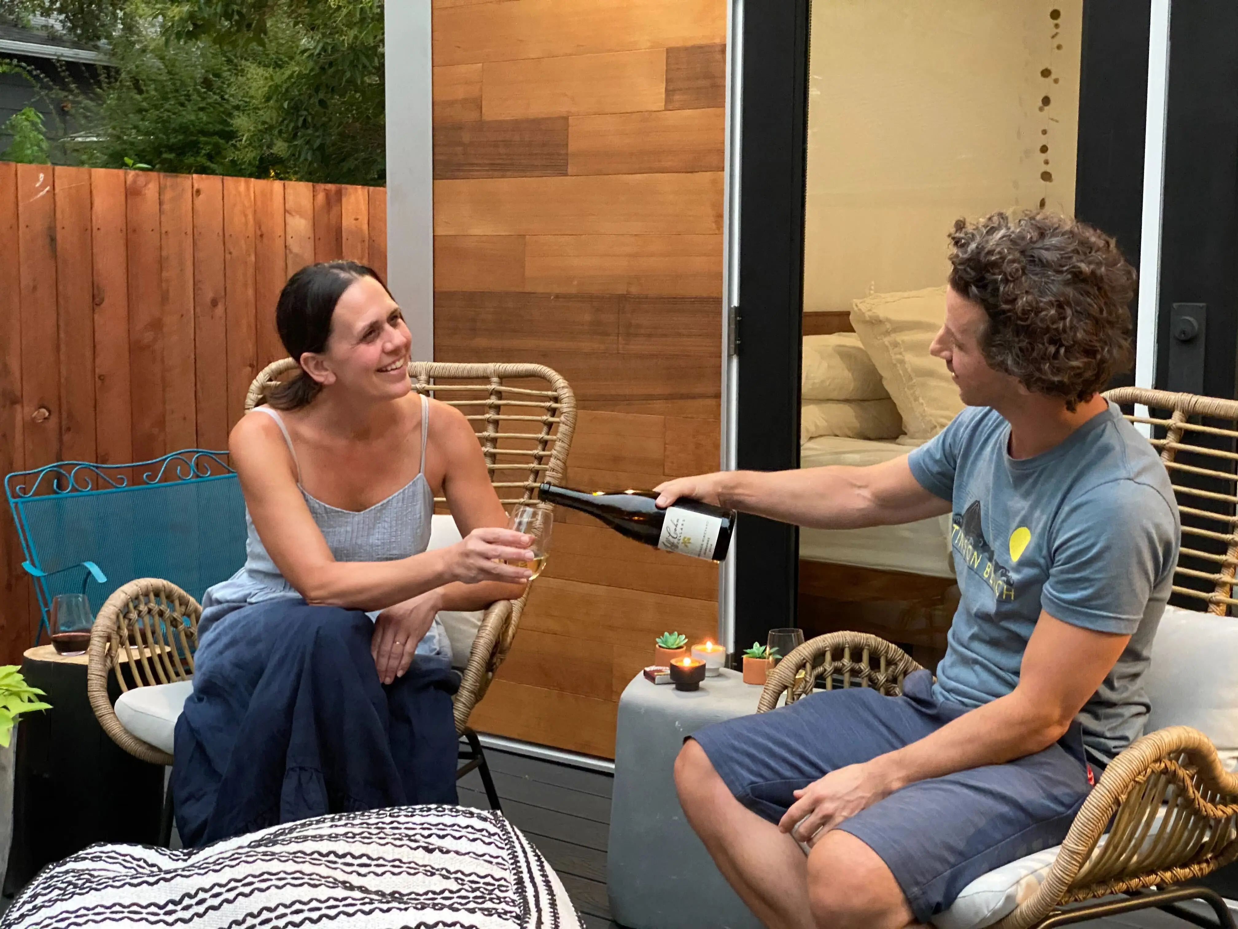 Julie Fornasero and her husband Tim Logan drinking wine.