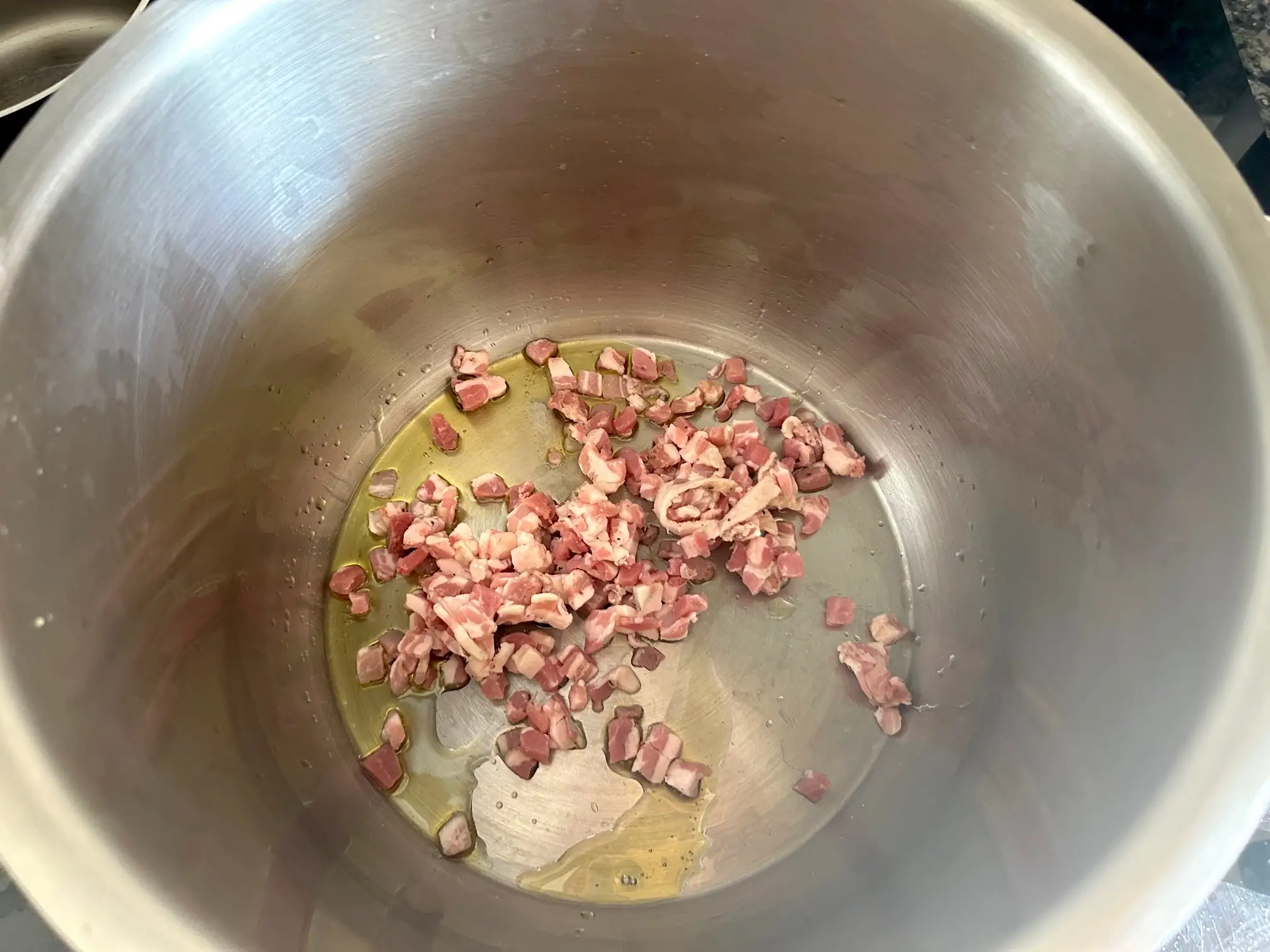 Cooking pancetta for Ina Garten's winter minestrone soup