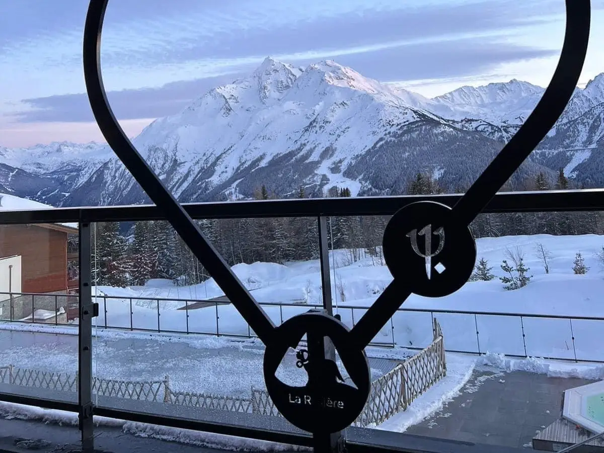 heart sign in front of a snowcapped mountain