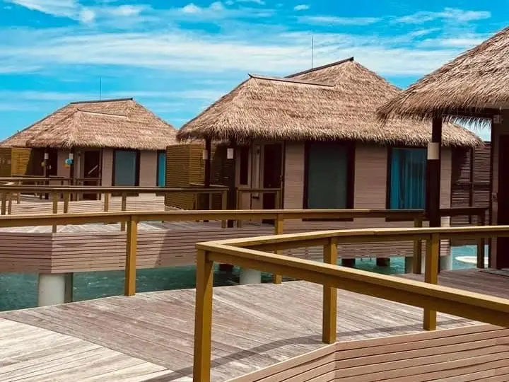 villas on the water at a resort in the maldives