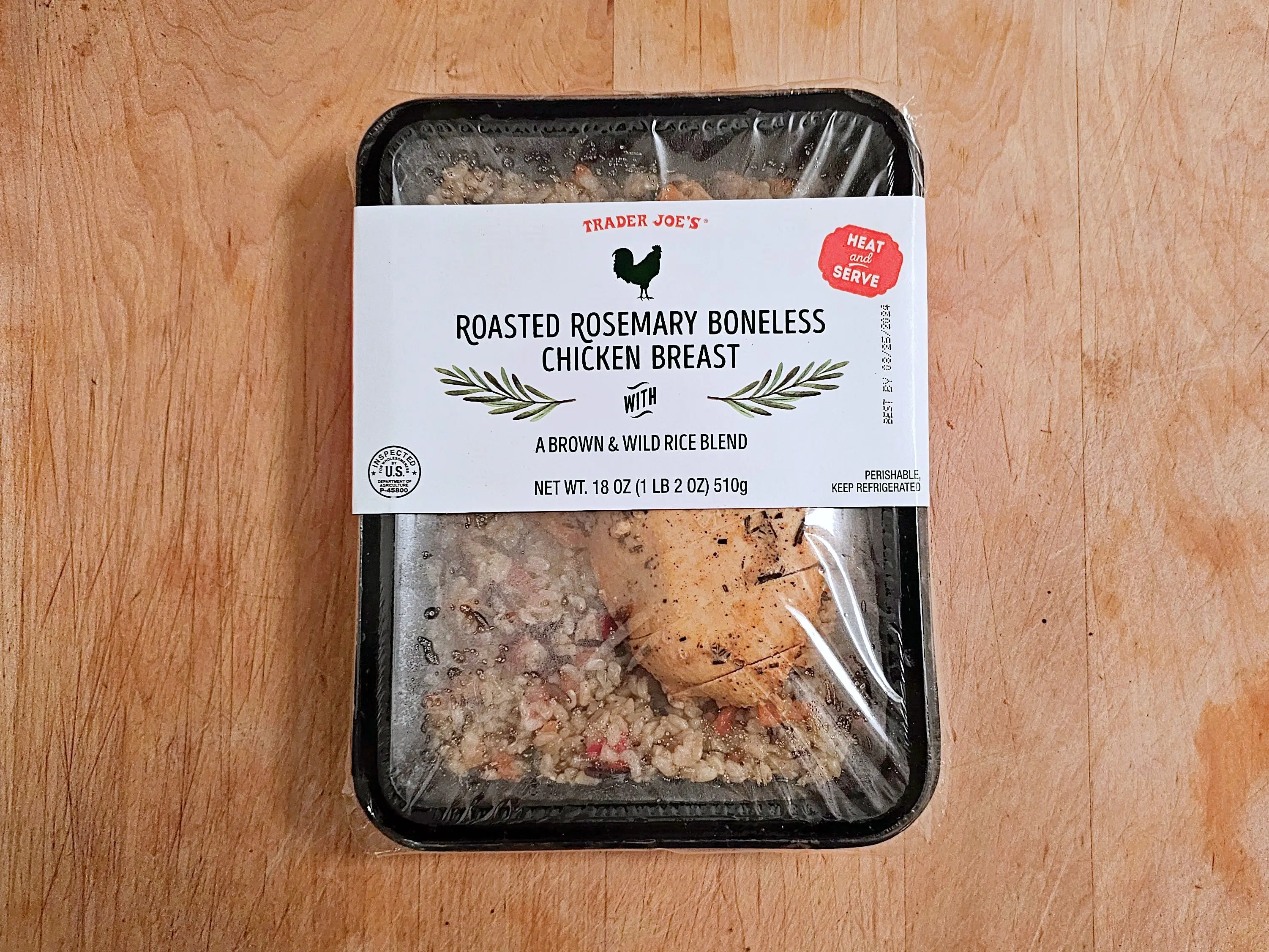 A packaged box of Trader Joe's roasted rosemary boneless chicken breast.