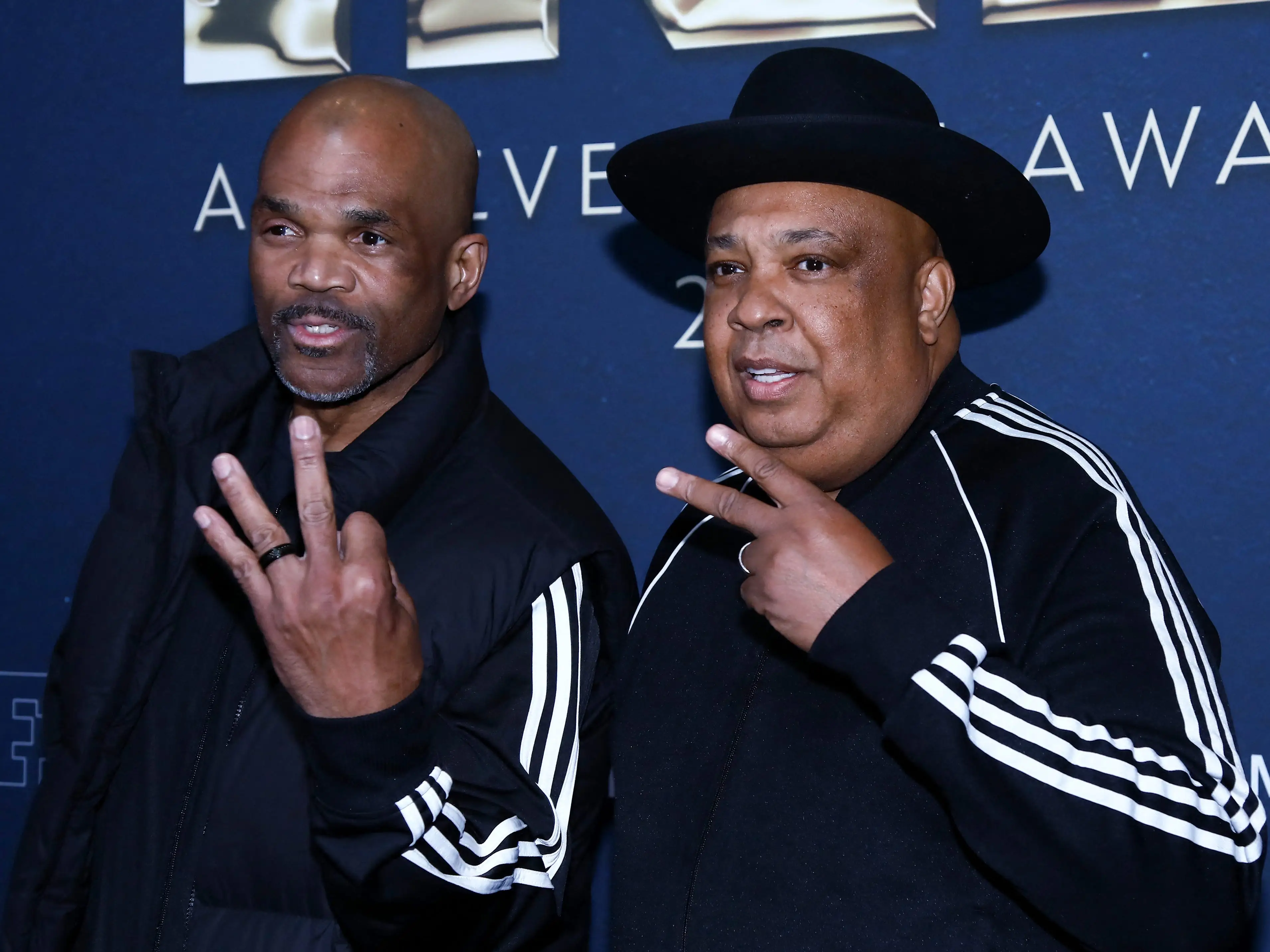 two original members of Run-D.N.C. posing for a photo