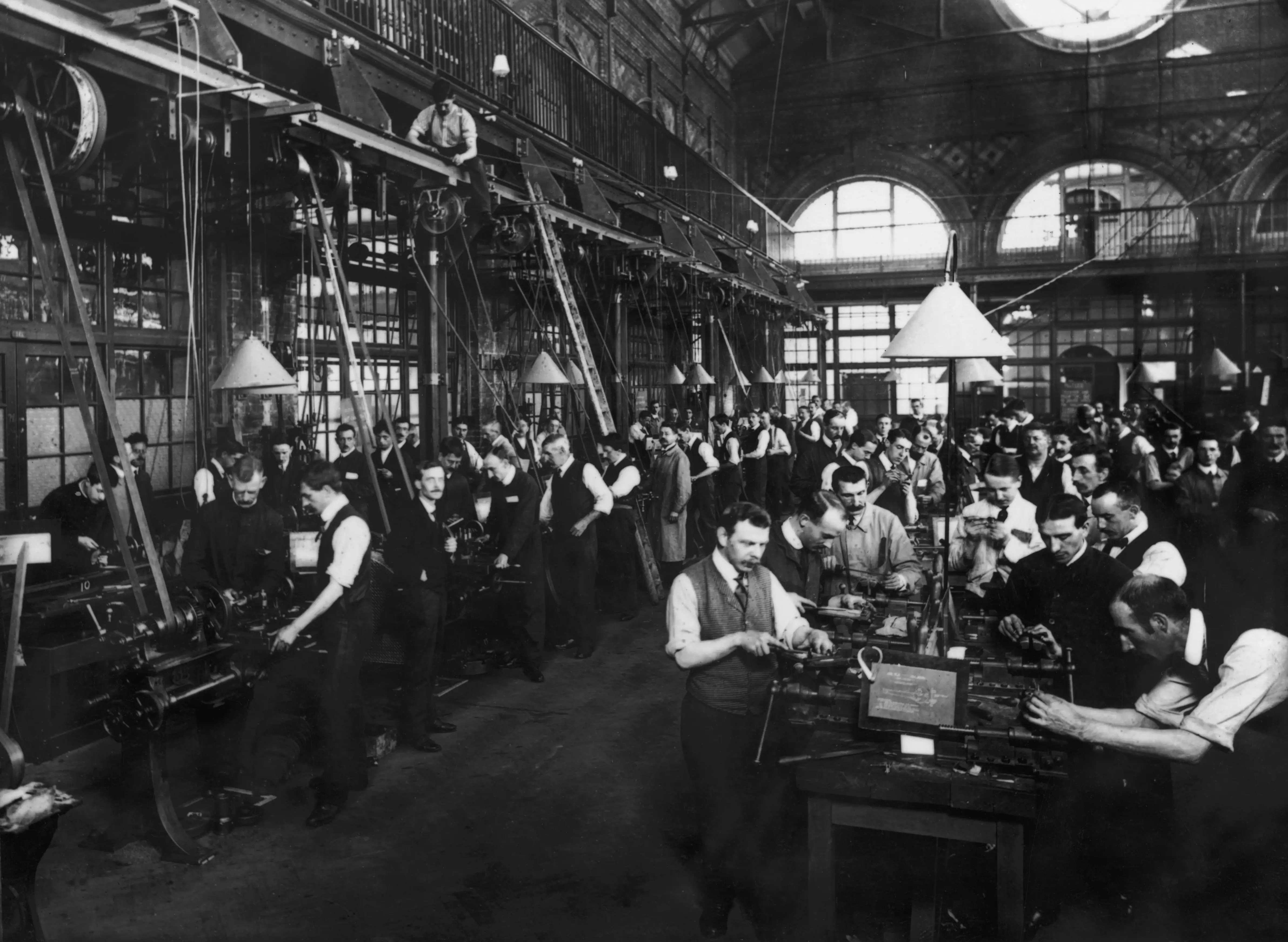 Men at work in a factory, circa 1900.