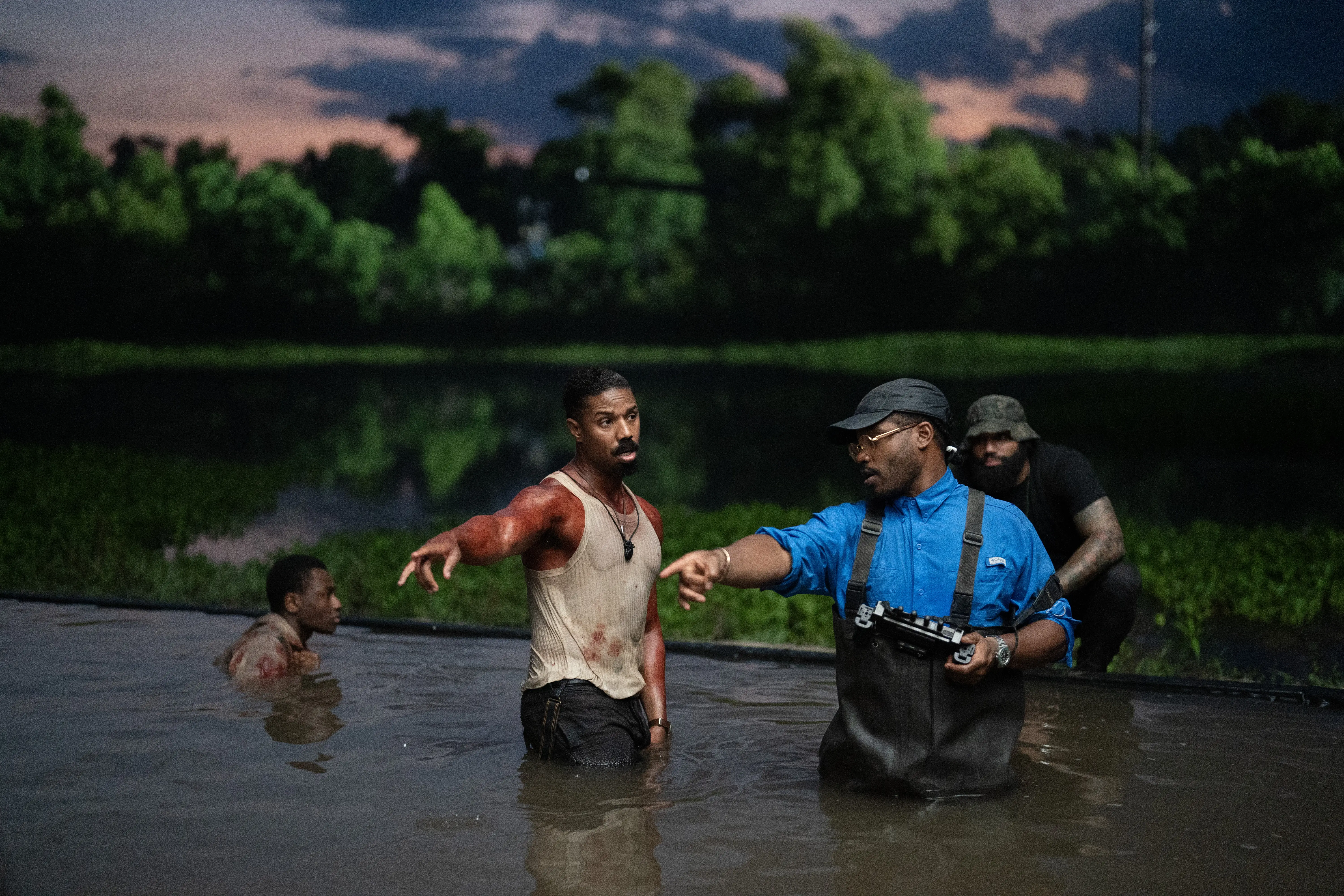Michael B Jordan and Ryan Coogler in water