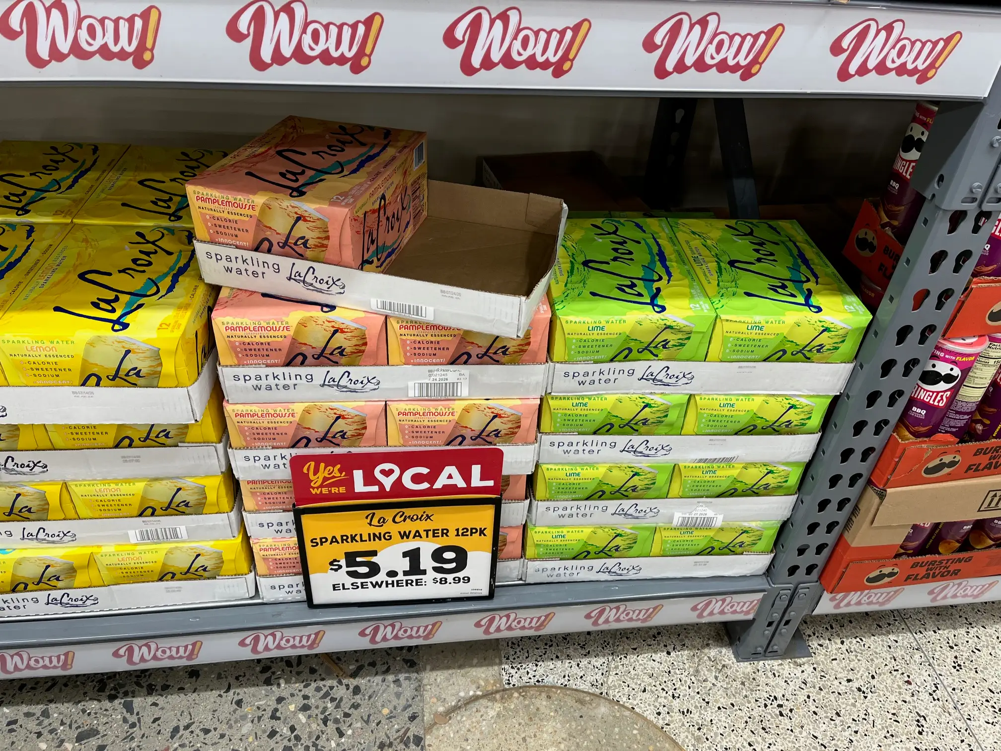 Cases of La Croix sparkling water sit on a shelf at a Grocery Outlet store.