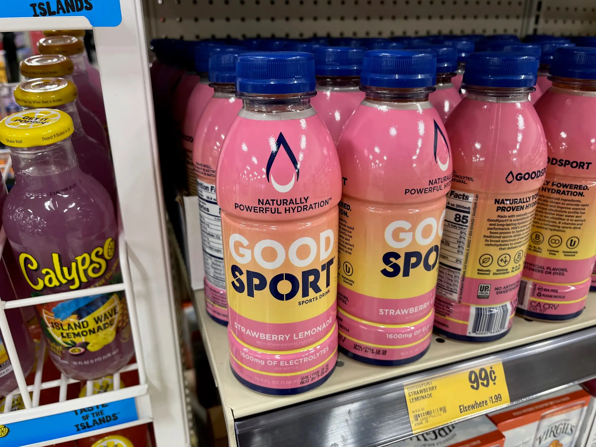Bottles of Good Sport beverages sit on a shelf at Grocery Outlet.