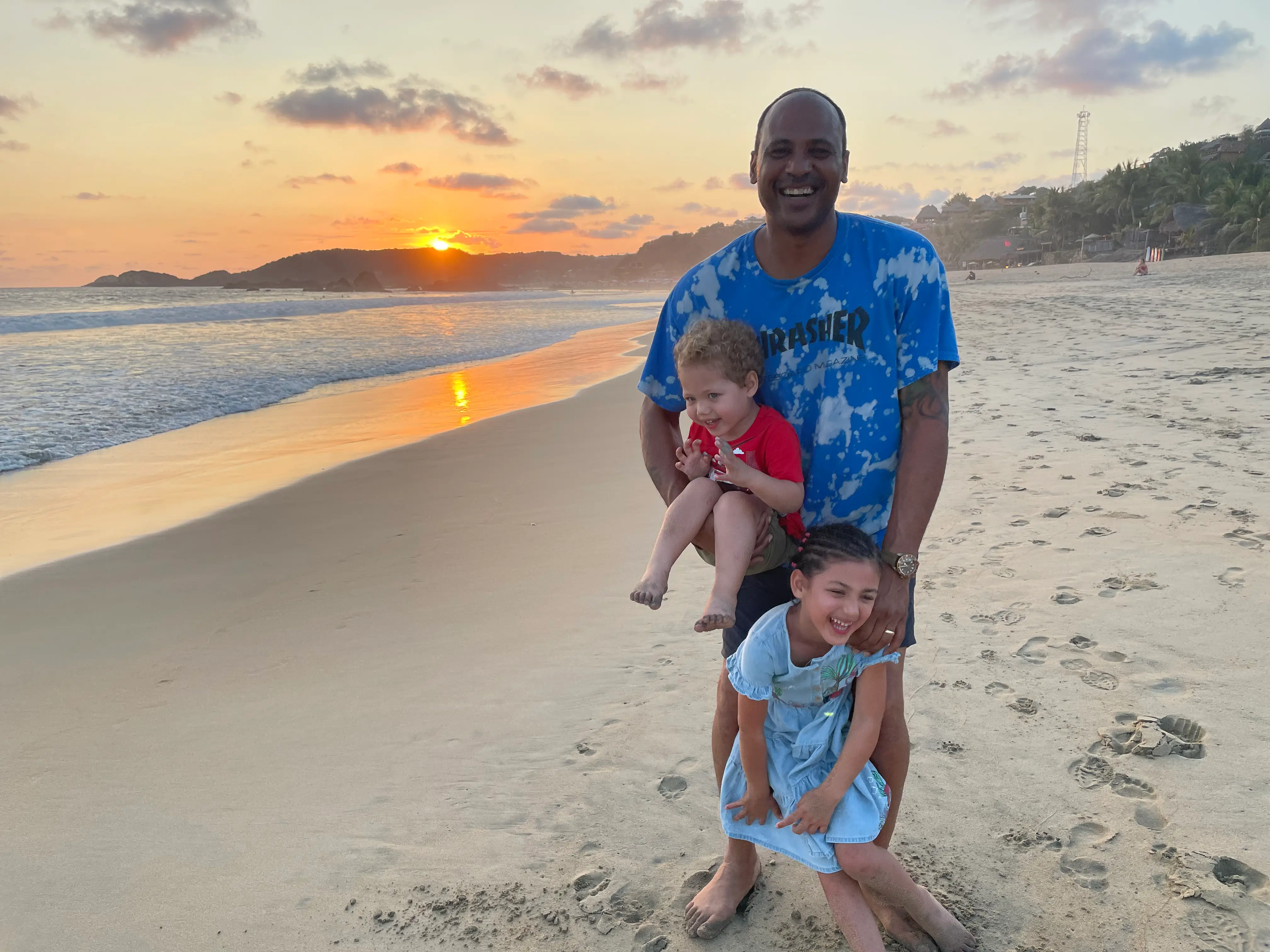 Man with two children at beach