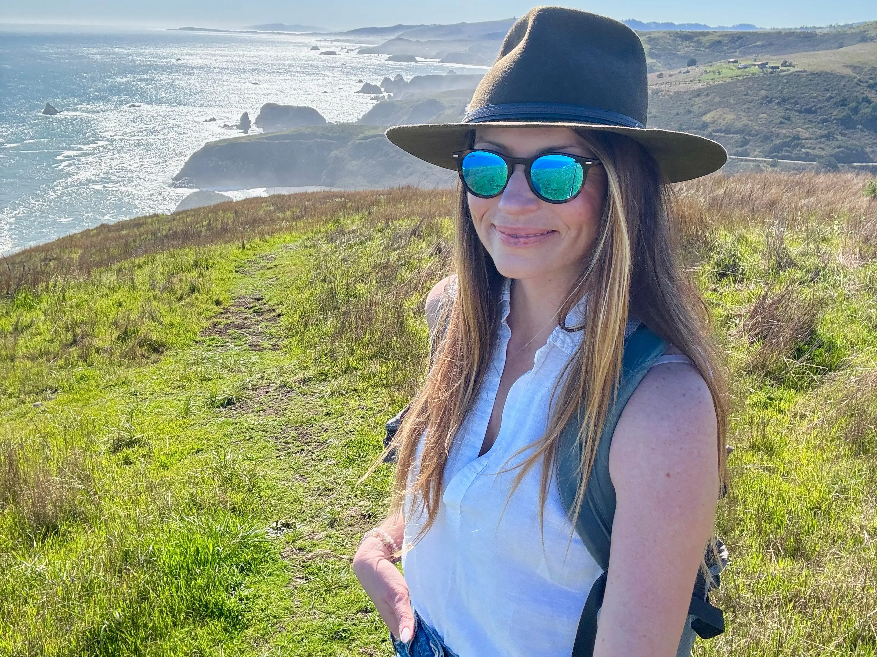 Emily taking a selfie on the Sonoma Coast.