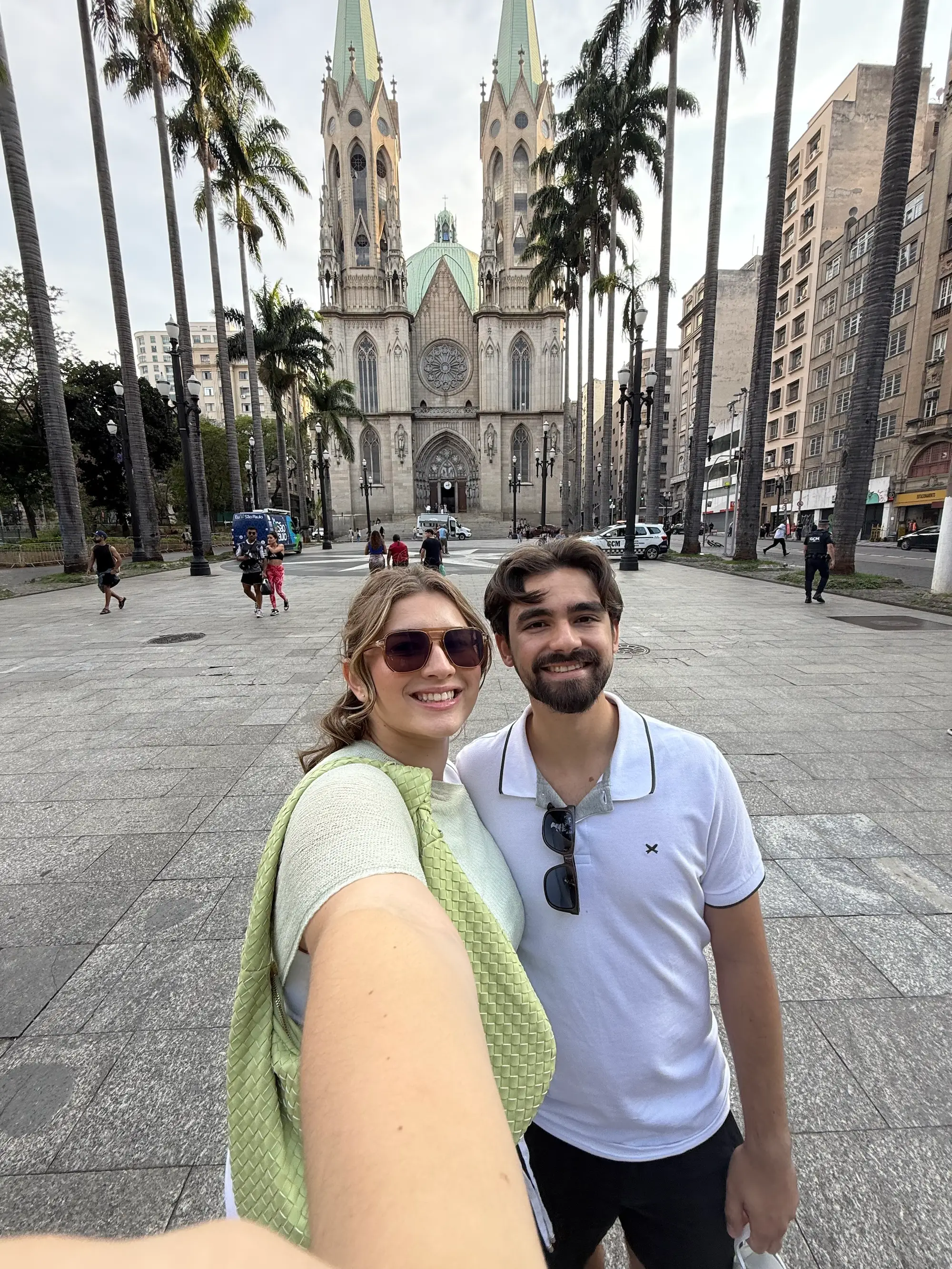 A selfie of a couple in front of a historic church.