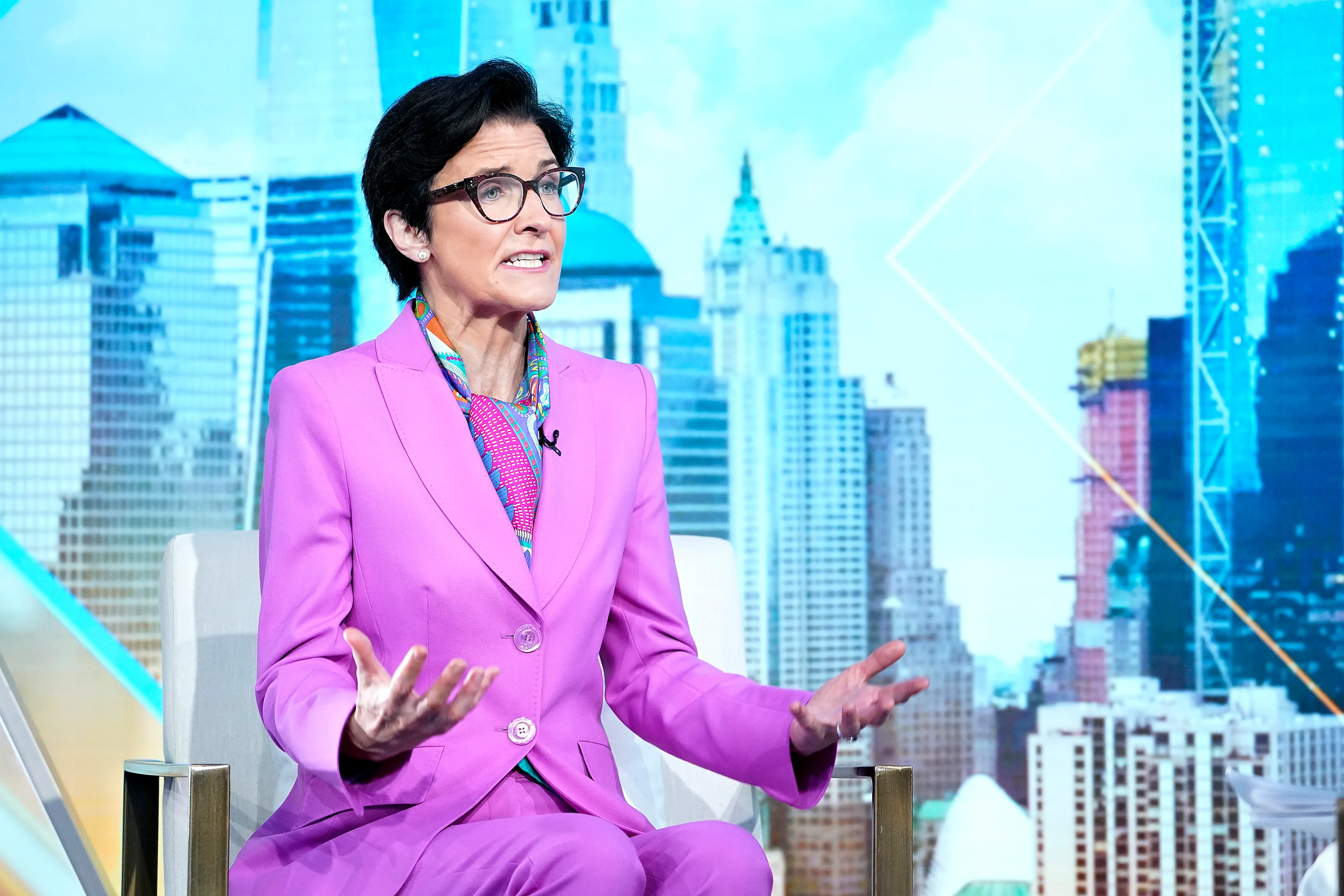 Jane Fraser, CEO of Citigroup, on television in a pink suit