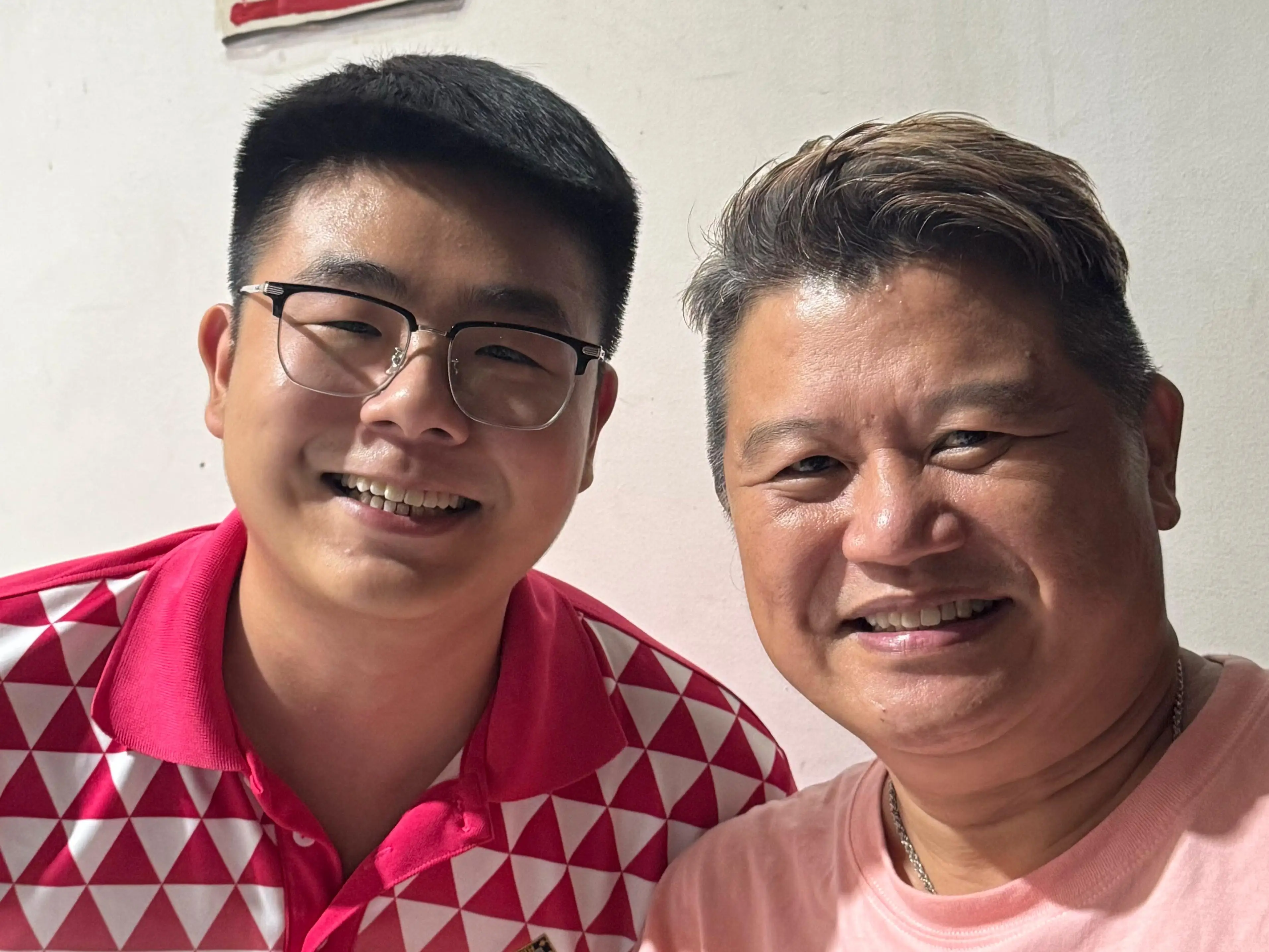 Ethan Tan and his father, Novestine Tan.