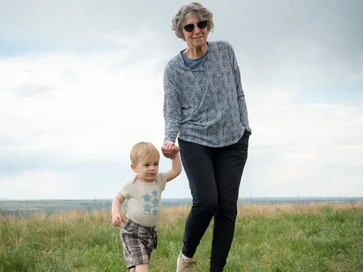 Grandma and grandchild walking