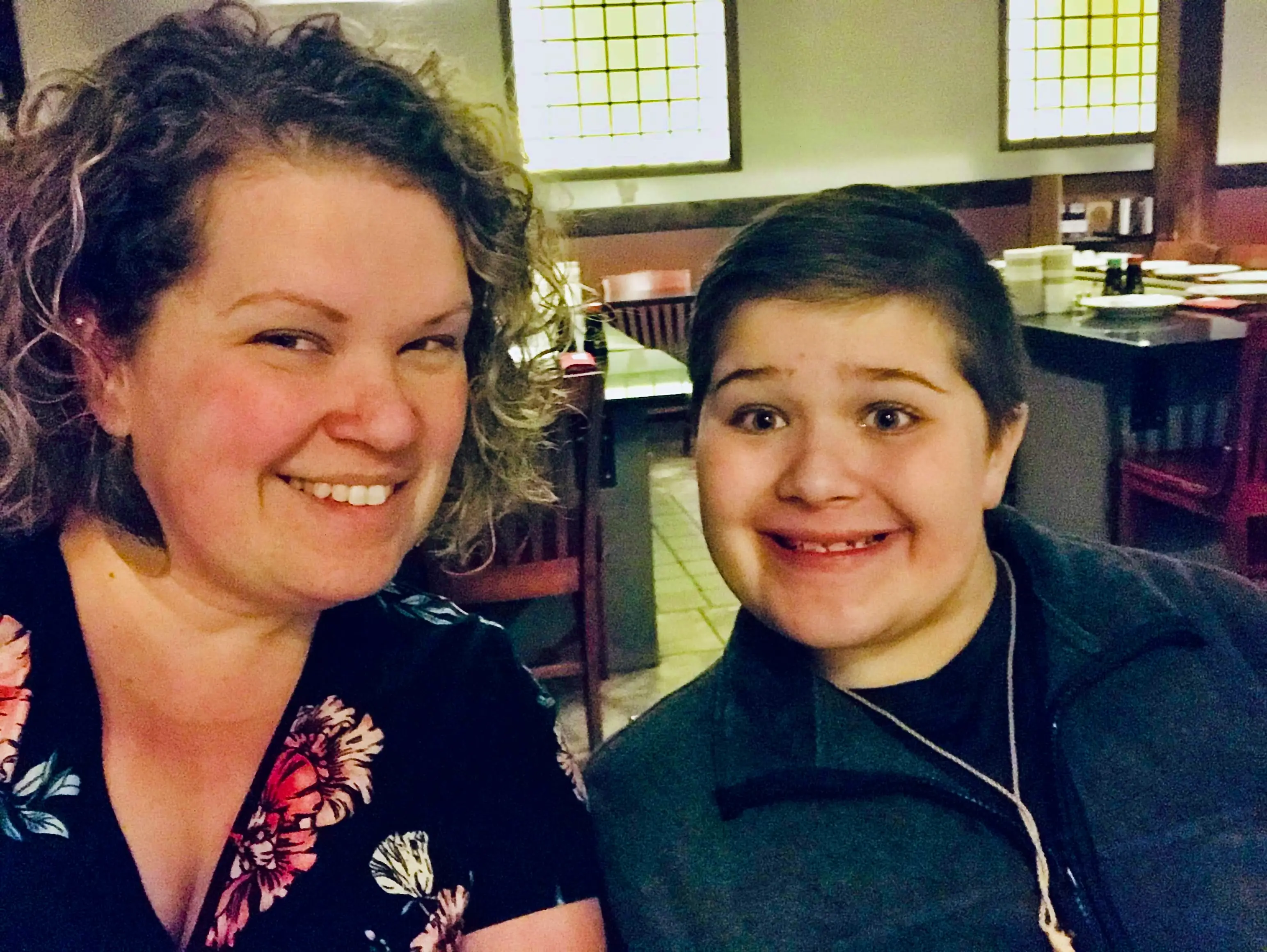 Mom and child posing for photo