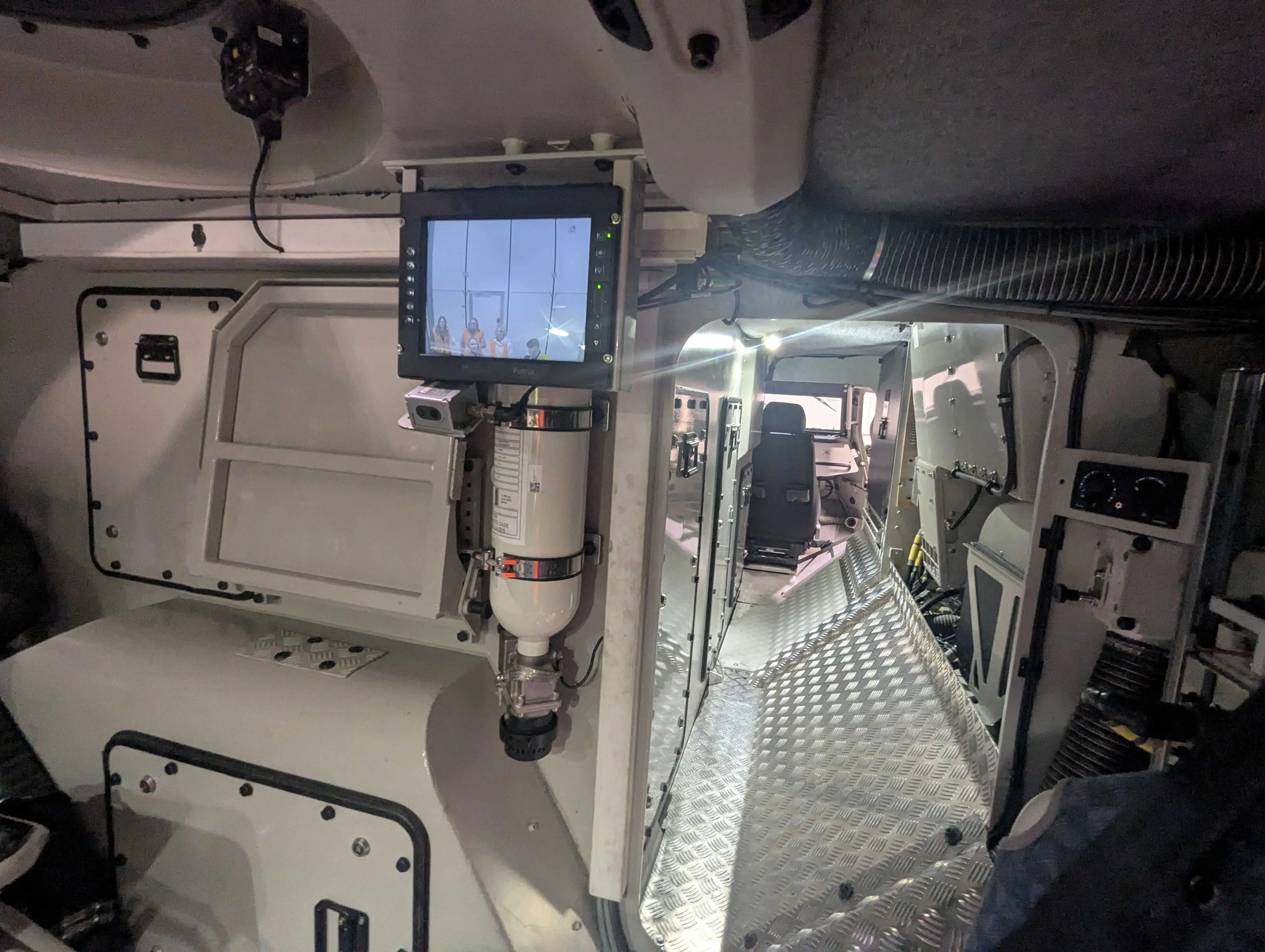 The interior of the Patria 6x6, facing the front.