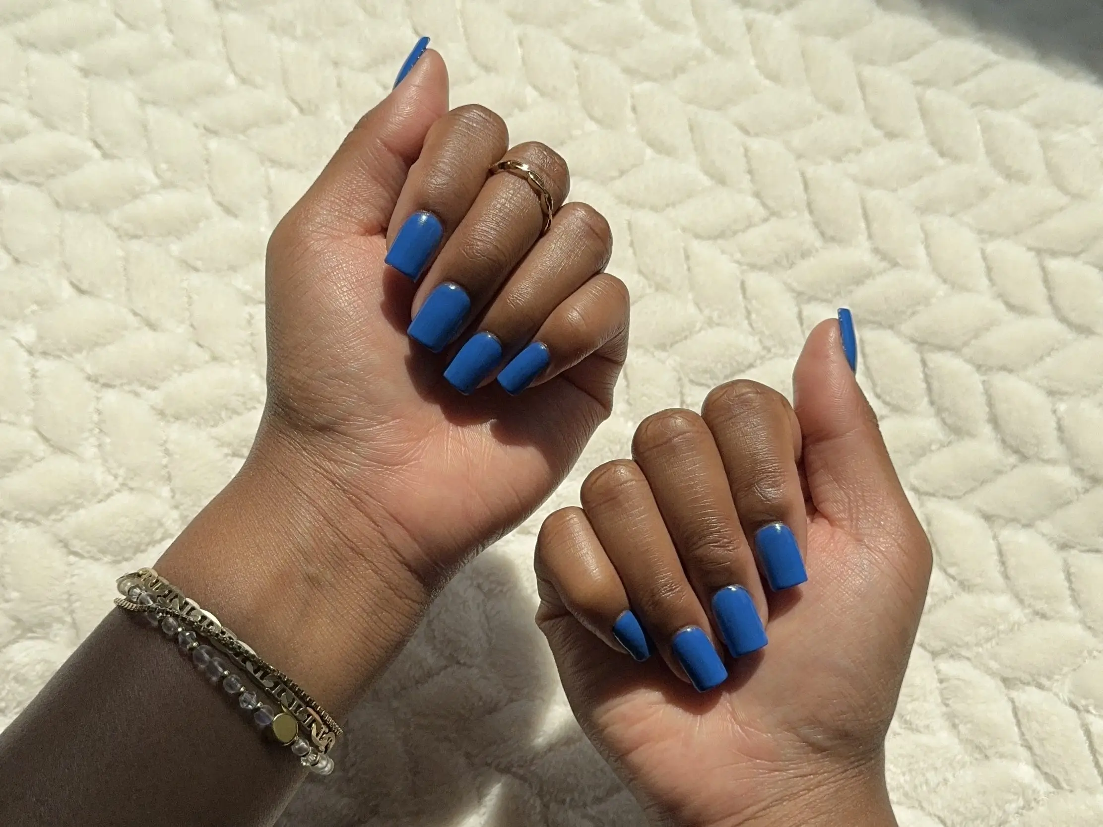 A cobalt-blue manicure.