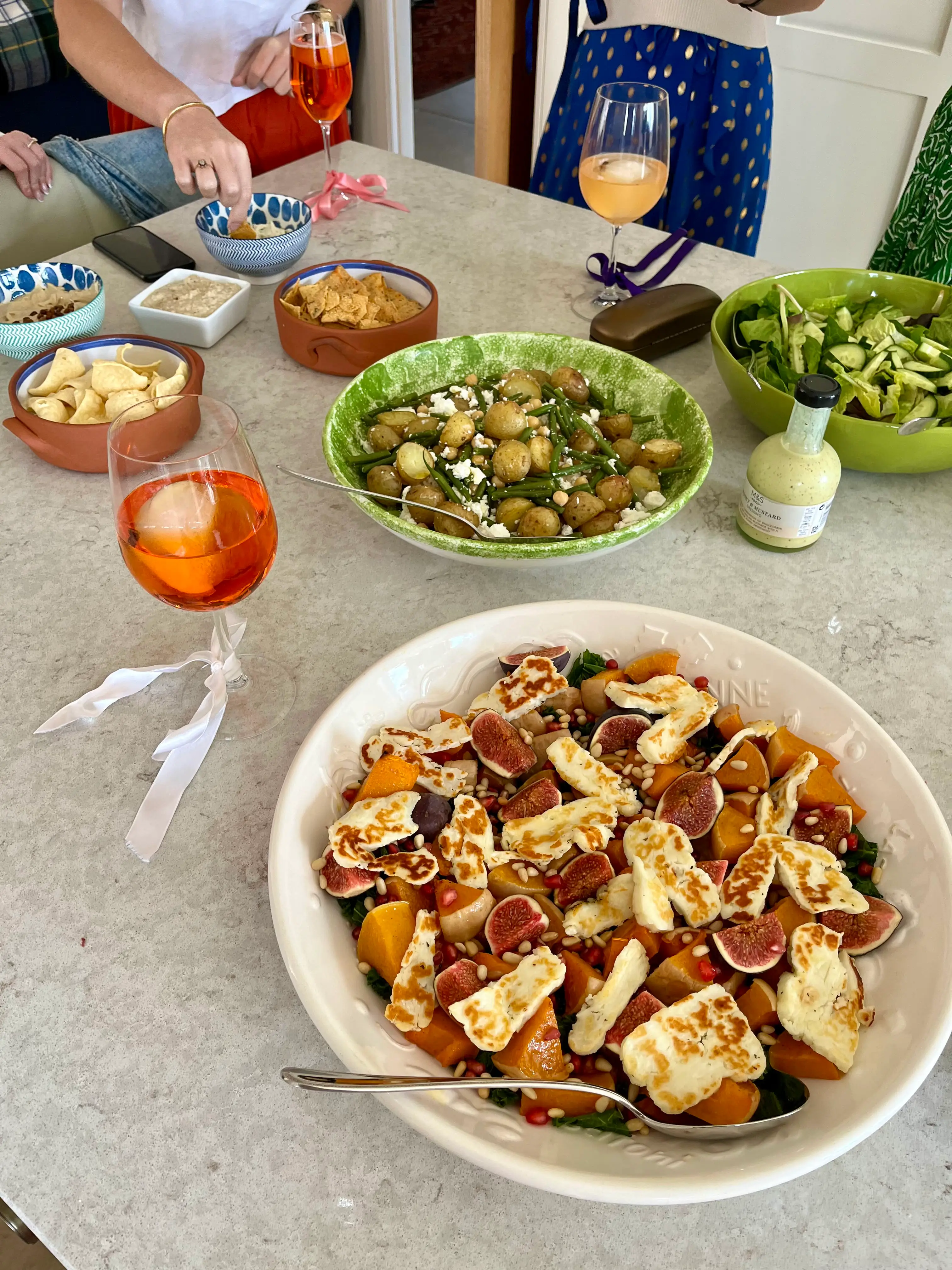 festive spritz with table of food