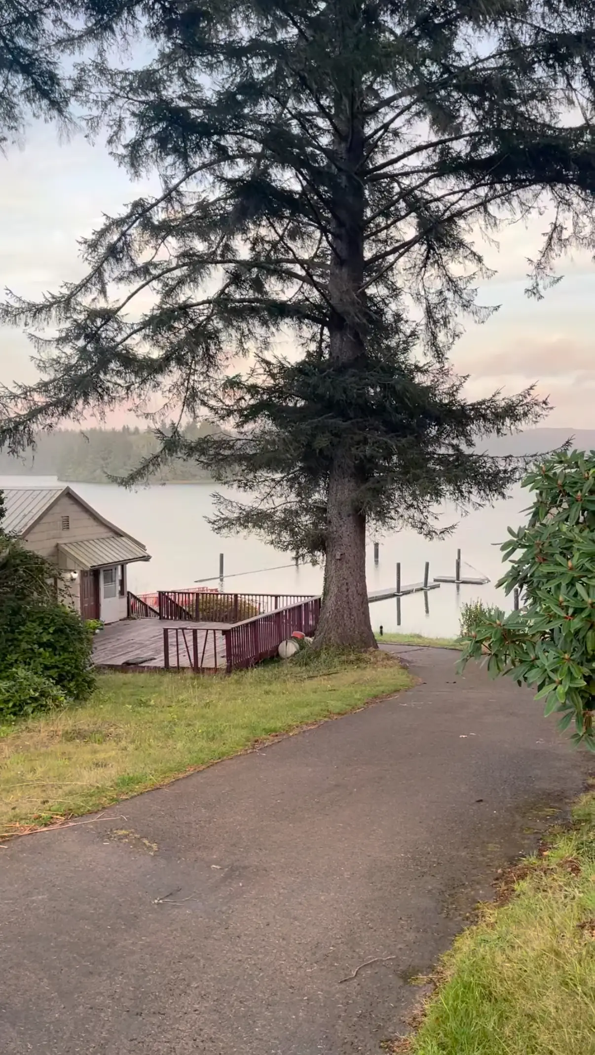 A view of a rundown home on a body of water.