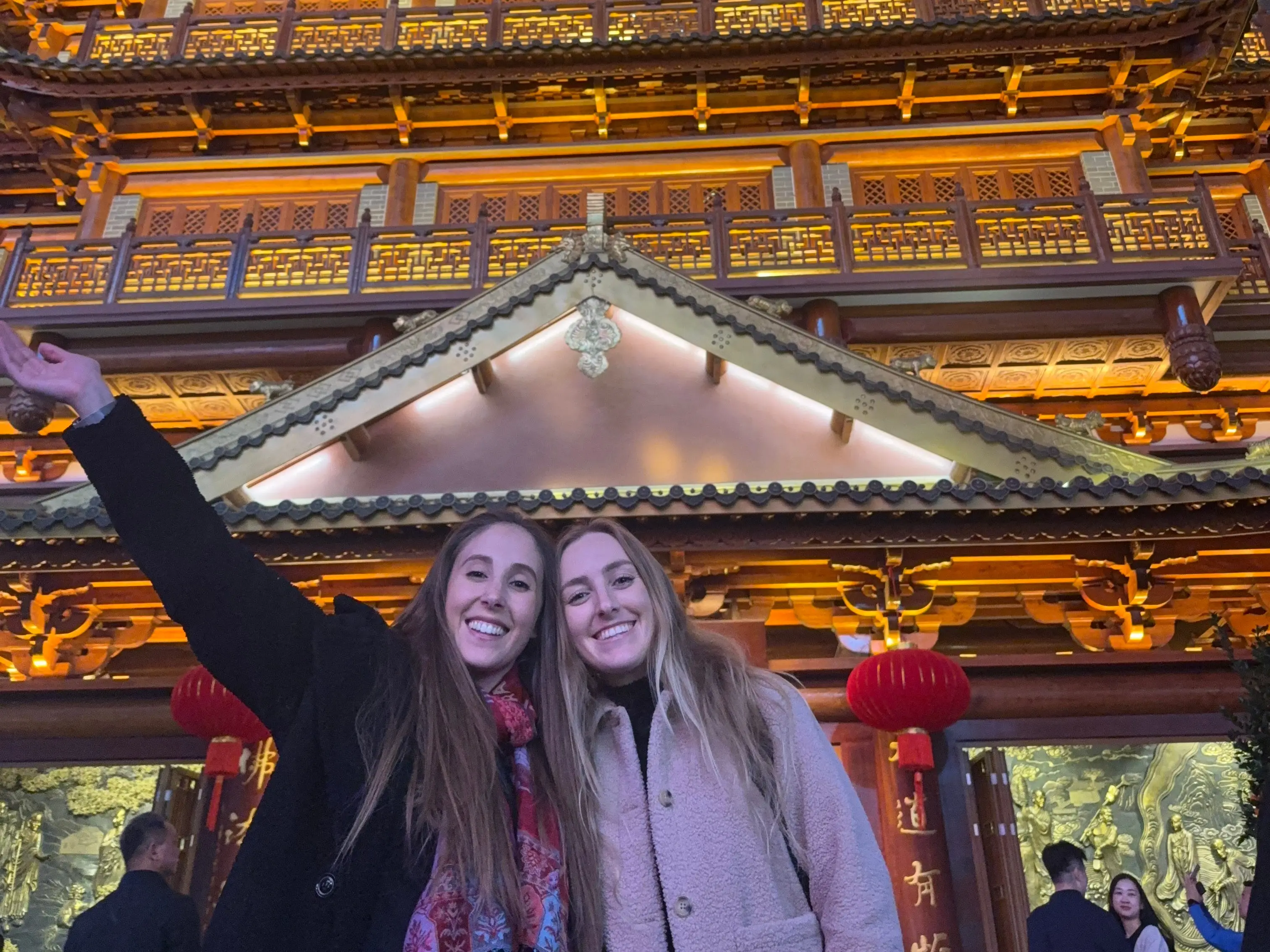 A selfie of two girls in front of a famous temple in Guangzhou, China.
