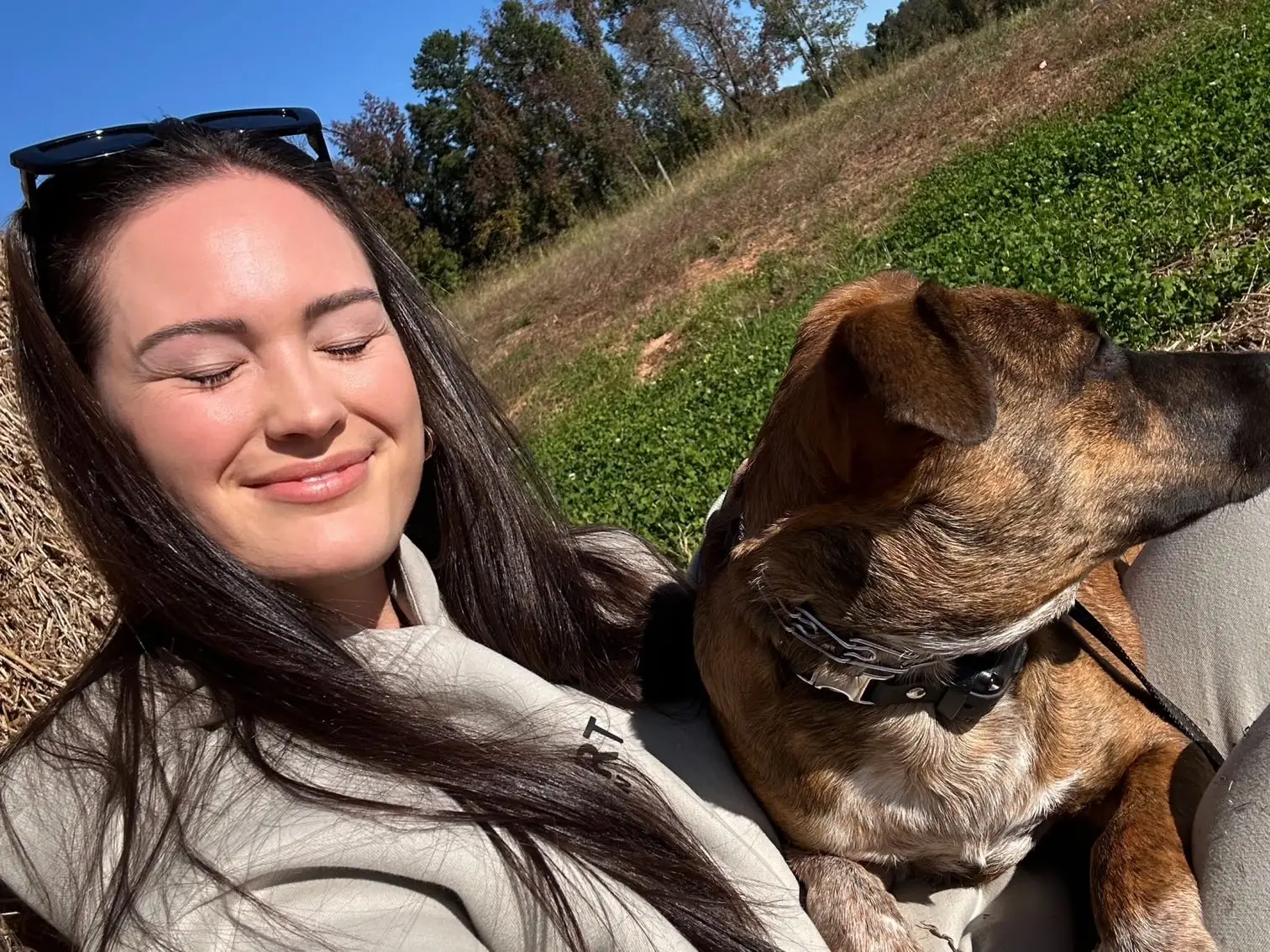 Author Hayley Hutson smiling with dog in Denver, NC