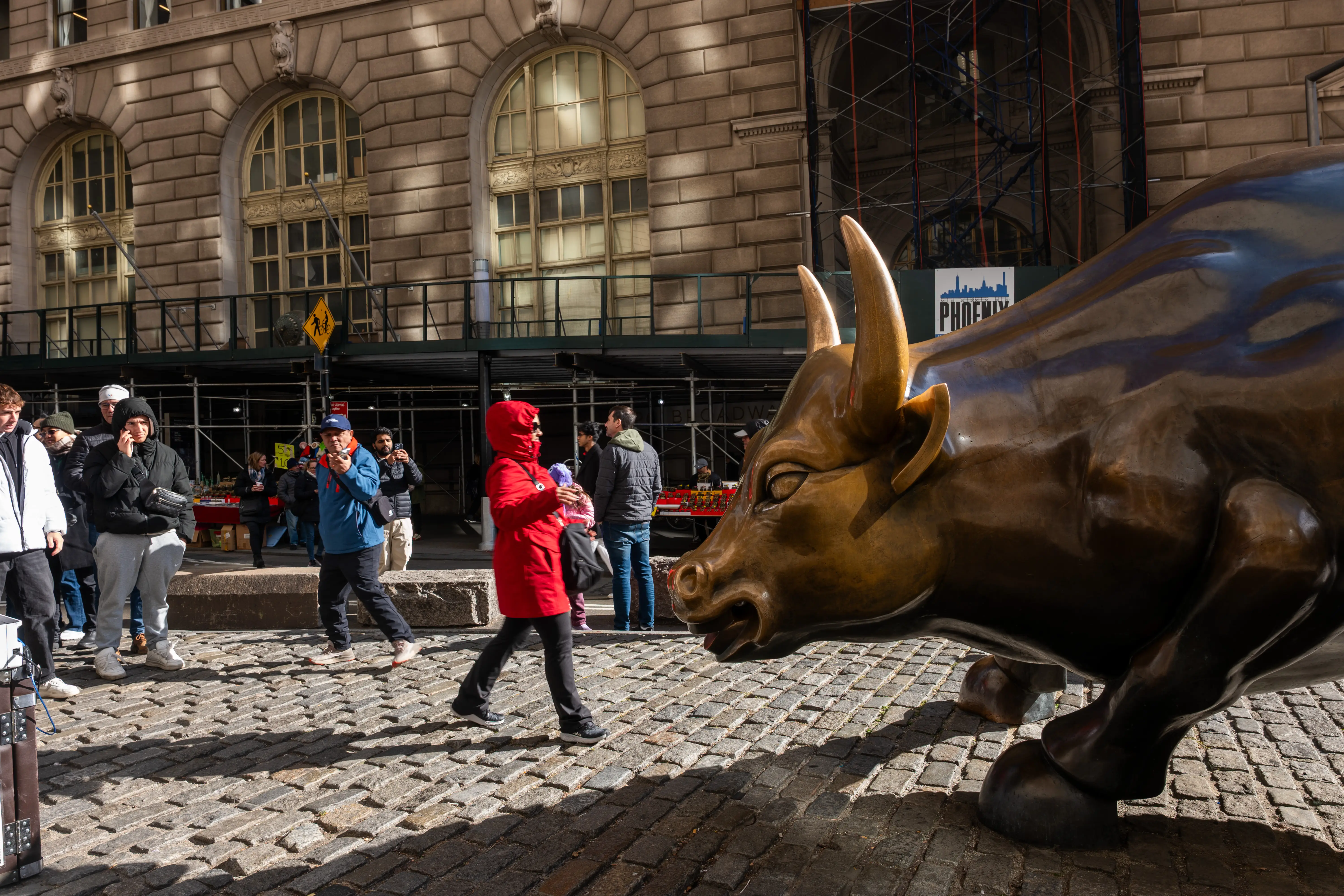 The Wall Street bull stands in the financial district near the New York Stock Exchange