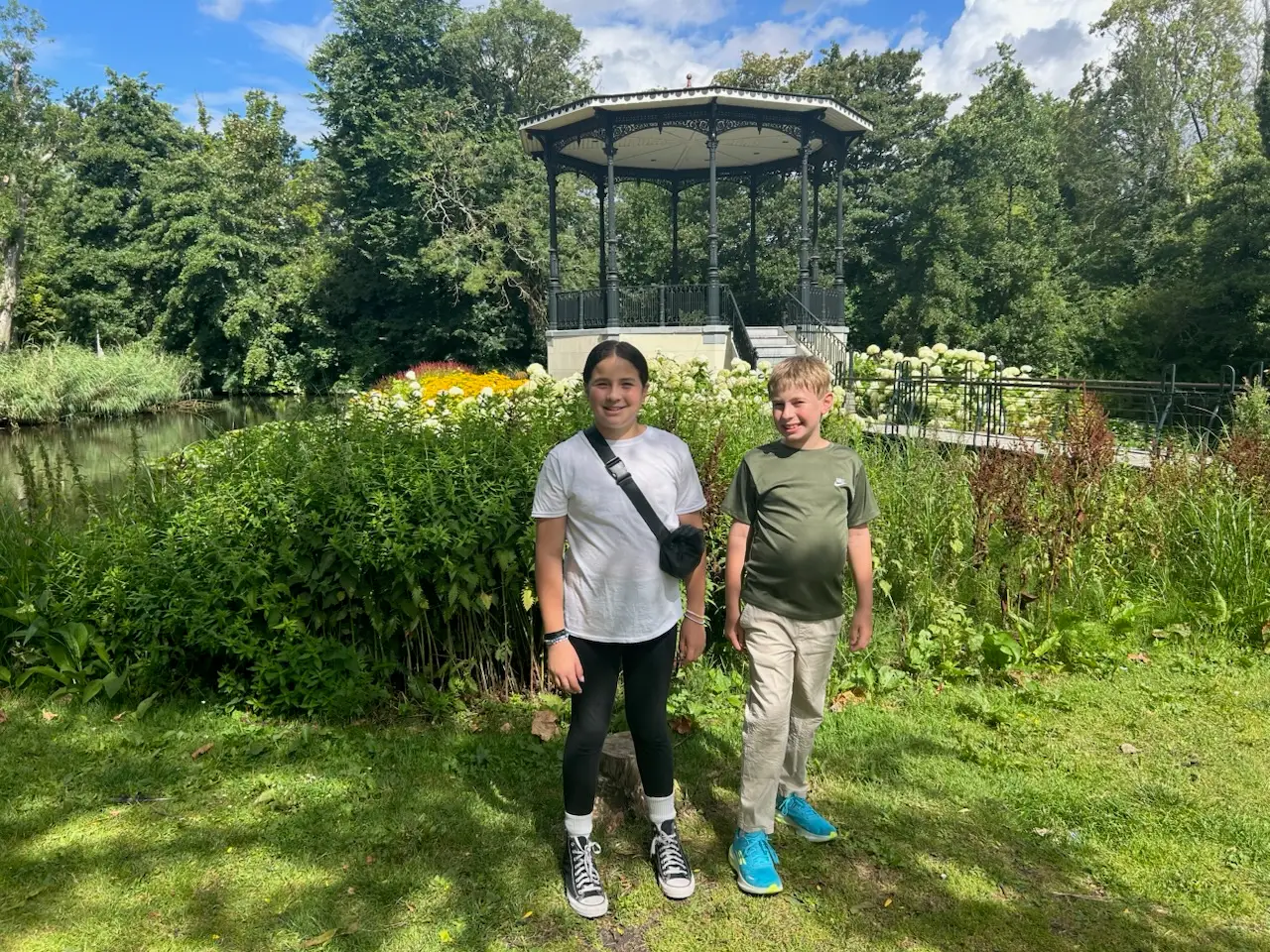 Two kids standing in park in amsterdam